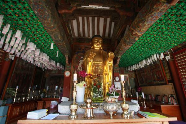 golden temple inside. Golden Buddha statue inside