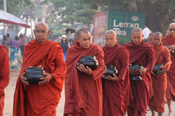 Monks collecting food in the