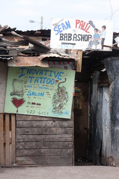 Photograph of Babashop and tattoo shop in the market of Kingston Jamaica 