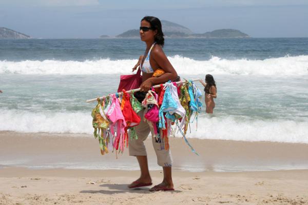 Image of Ipanema beach girl selling swimwear Rio de Janeiro Brazil
