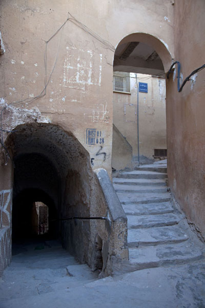 Stairs leading up an alley through an arch | El Atteuf | Algeria