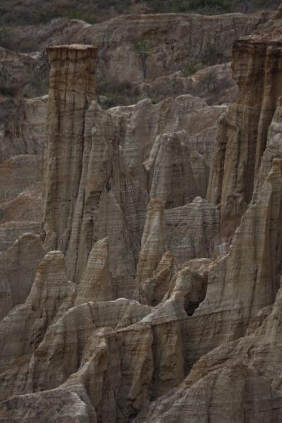 Foto van Close-up of pinnacles at the foot of the cliffs of the rugged landscapeMiradouro da Lua - Angola