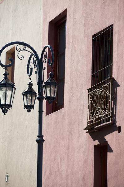 Picture of Caminito (Argentina): Windows and lantern in wall in Caminito