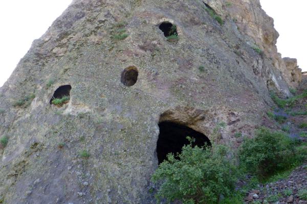 Looking up a rock face with cave dwellings | Goris cave dwellings | Armenia