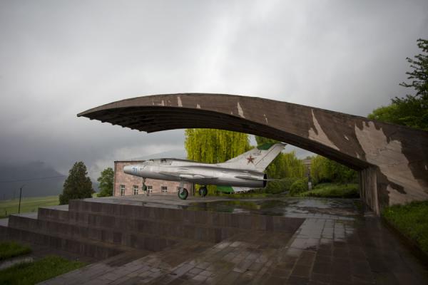Picture of Mikoyan museum (Armenia): Silver MiG fighter plane on display under a concrete cover