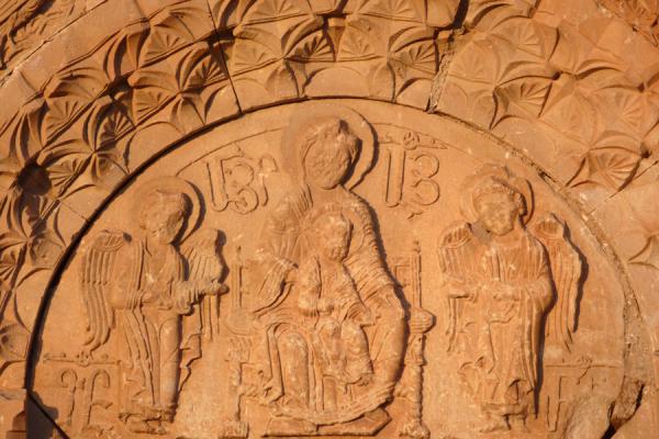 Frontal view of a carved scene of Mother Mary with child | Noravank monastery | Armenia