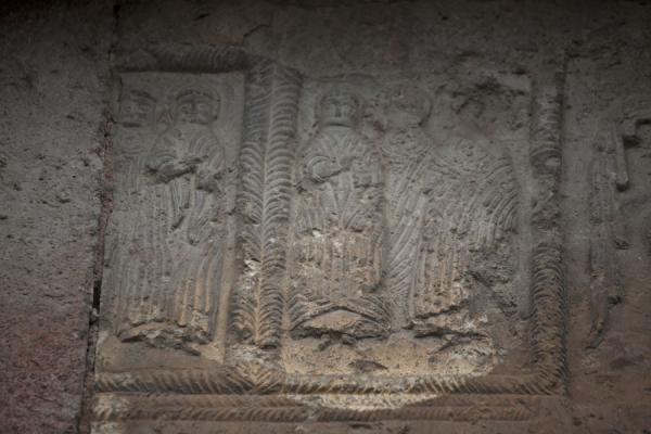 Picture of Odzun church (Armenia): Figures carved out on a fourth century stone in the outer wall of Odzun
