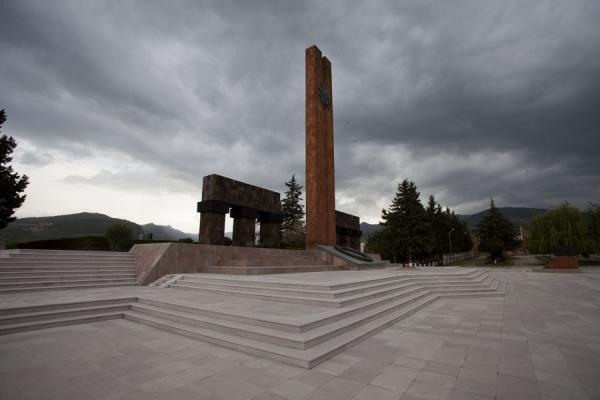 Picture of Obelisk standing high above the complex grounds with dark clouds aboveStepanakert - Armenia