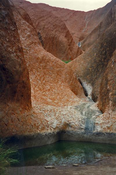 Small water pool at the bottom of Ayers Rock | Uluru Ayers Rock | Australia