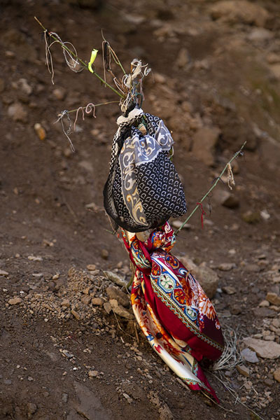 Picture of Colourful scarves tied to the ground in one of the open cavesAshabi Kahf - Azerbaijan