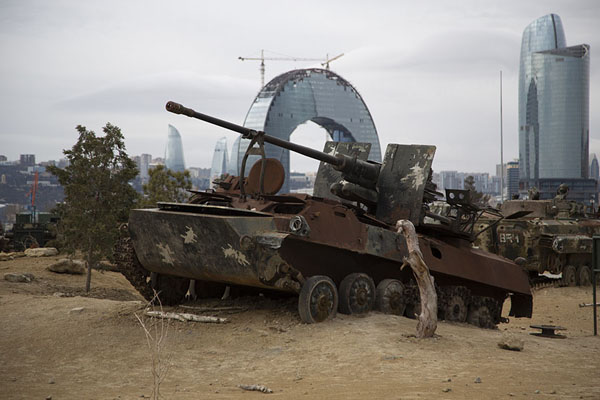 Picture of Destroyed Armenian tank with modern buildins of Baku in the background