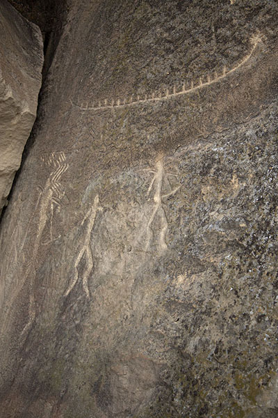 Humans and a boat carved out in a rock | Gobustan Petroglyphs | Azerbaijan