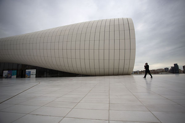 Picture of Man walking past the southwest side of Heydar Aliyev Centre