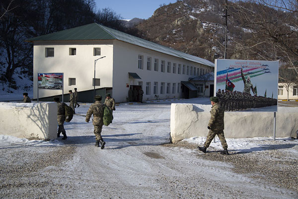 Picture of Kalbajar expedition (Azerbaijan): Soldiers at a military barrack in the Karabakh region with victory poster of the last war