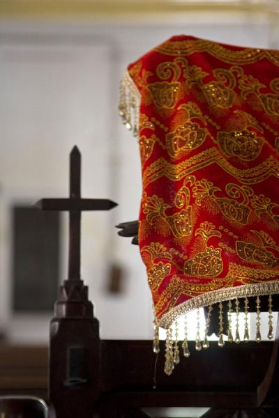Picture of Still with traditional cloth and wooden cross in the Armenian church