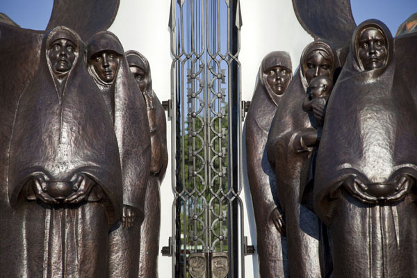 Statues of women lined up outside the monument | Island of Tears | Belarus