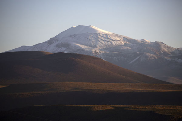 Picture of Southwest Bolivia landscapes (Bolivia): Snow-capped mountain catching the first rays of sunlight near Quetena Chica in southwest Bolivia
