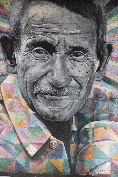 Picture of Wall paintig of a man in black-and-white and colourful clothesSão Paulo - Brazil