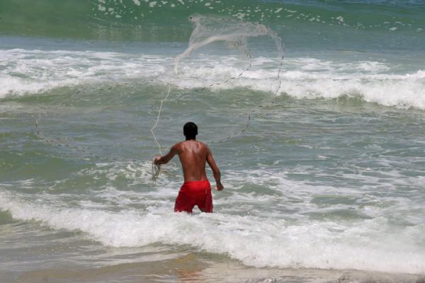 Picture of Ipanema beach: fisherman in the surf