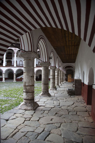 View from within one of the porticos of the residential area of Rila Monastery | Rila Monastery | Bulgaria