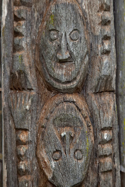 Picture of Two heads carved into a column of the Case
