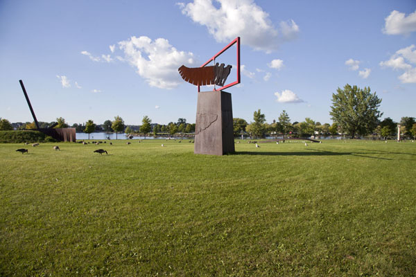 Picture of Vire-au-vent in the middle of the picture, on the open space in the middle of the peninsula of Parc René Lévesque