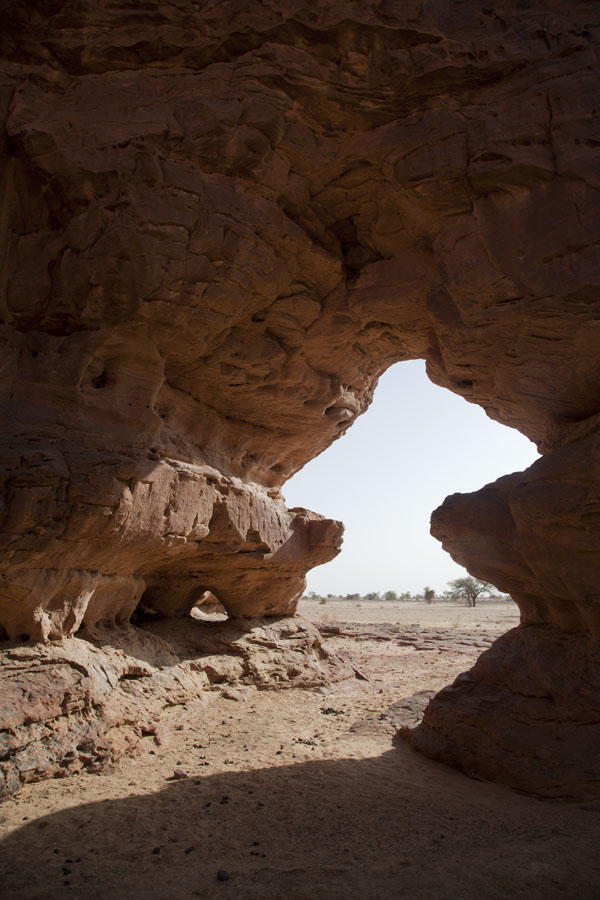 Looking through one of the many arches on the west side of the Terkei massif | Terkei amphitheatre west | Ciad