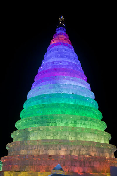 Picture of Ice and Snow World (China): Christmas tree made of ice in the evening