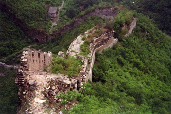 Crumbling Great Chinese Wall running down a hill | Huanghua Great Wall of China | China