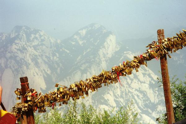Picture of Huashan Mountain (China): Locks attached to rail protecting climbers from the abyss below