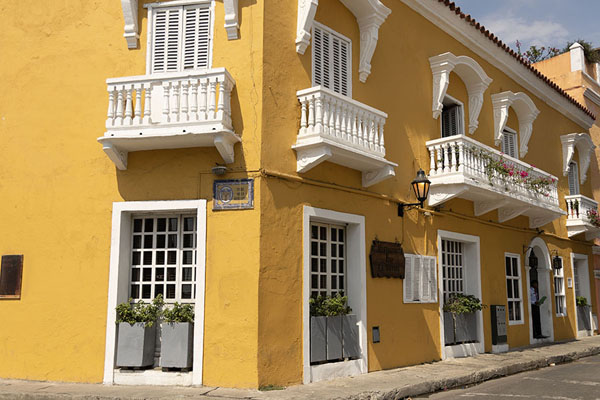 Foto di Colonial yellow house with white balconies in the historic district of Cartagena - Colombia - America