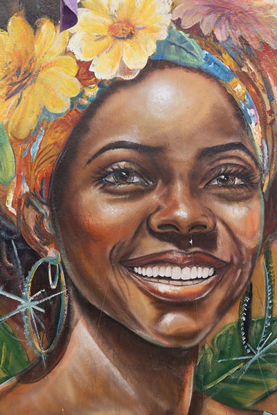 Foto van Joyful woman painted on a wall in GetsemaníCartagena - Colombia