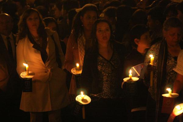Picture of People walking with candles to accompany the Semana Santa procession