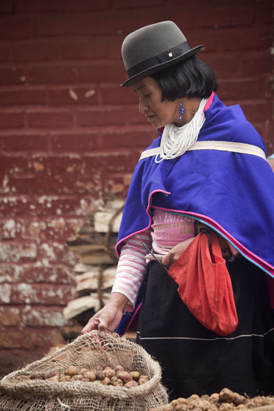 Guambiano woman in traditonal attire at the market of Silvia | Silvia Market | Colombia