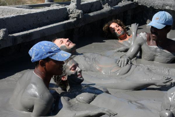 Picture of Totumo Volcano (Colombia): Visitors getting a massage from locals inside Volcano Totumo