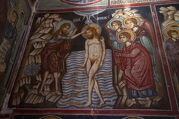 Foto van Fresco depicting a naked Jesus in the river Jordan with fish swimming around his legs in Archangel Michael church in PedoulasTroodos - Cyprus
