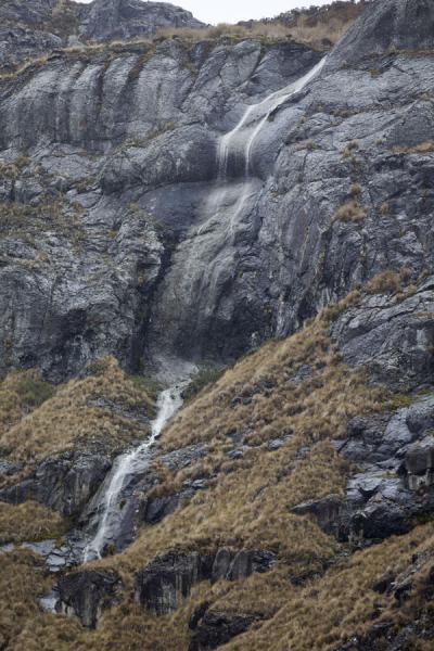Waterfall running down the rocky face of a mountain in El Cajas | El Cajas National Park | Ecuador