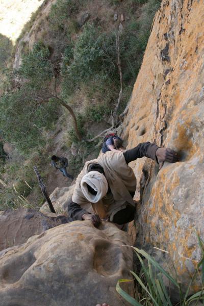 Climbing down the challenging wall of Abuna Yemata Guh | Abuna Yemata Guh church | Ethiopia