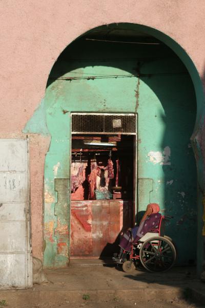Handicapped person at the butcher in Harar | Harar Street Scenes | Ethiopia