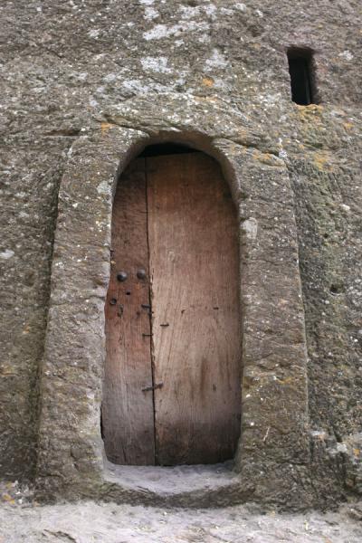 Door in the rocky wall near Bet Medhane Alem | Lalibela Northern Cluster | Ethiopia