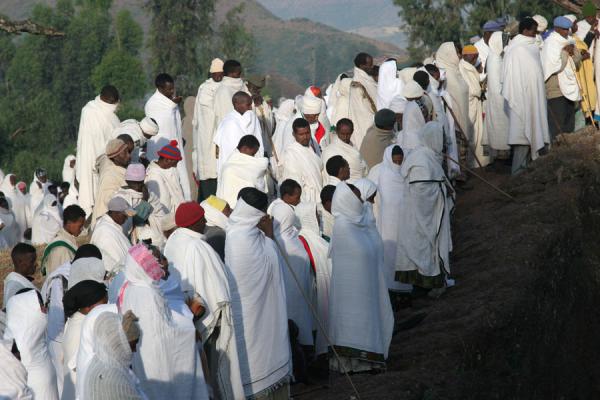 Picture of Sunday morning mass at Lalibela: worshippers above Bet Mikael