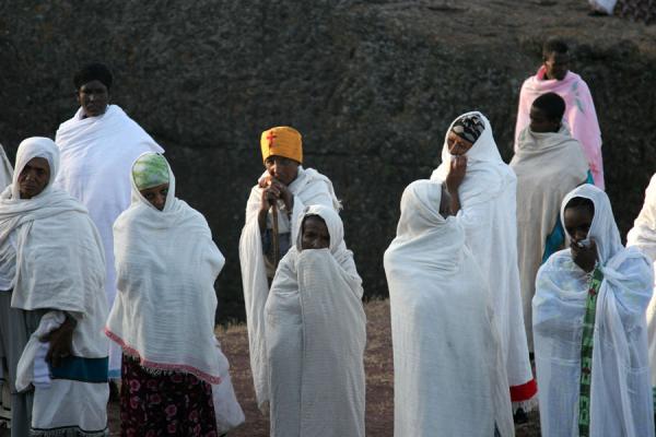 Women praying on top of the trench near Bet Mikael | Lalibela Sunday Mass | Ethiopia