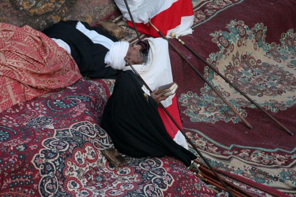 Tired priest having a break during Sunday morning mass | Lalibela Sunday Mass | Ethiopia