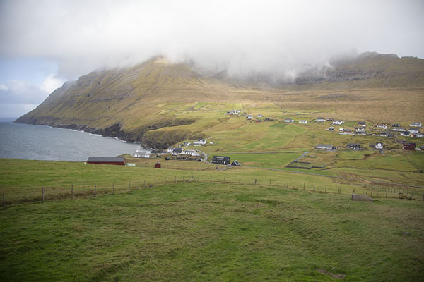 Picture of Villingadalsfjall enveloped in clouds rising from the sea