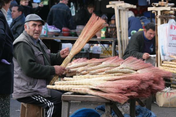 Georgian streetvendor preparing his wares in a market | Georgian People | Georgia