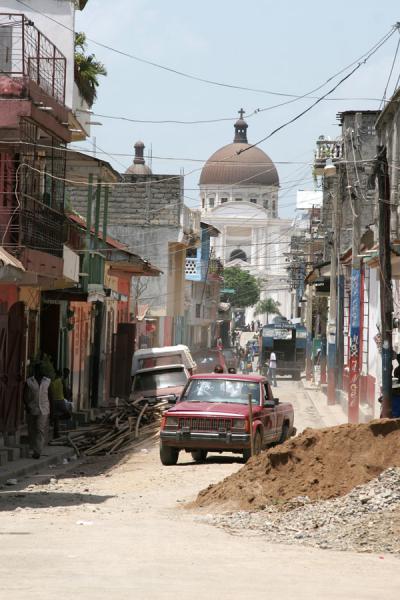 Typical scene in Cap-Haïtien: roadworks, car and the cathedral | Cap-Haïtien | Haiti