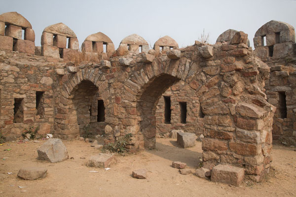 Picture of Defensive tower of Tughlaqabad Fort with arched wall