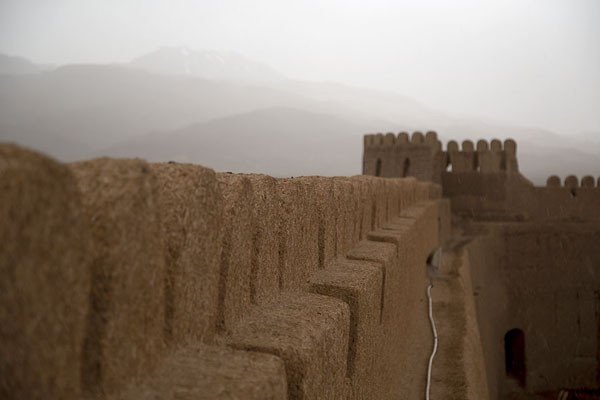 Photo de Rain from the mountains descending on the citadel of RayenRayen - Iran