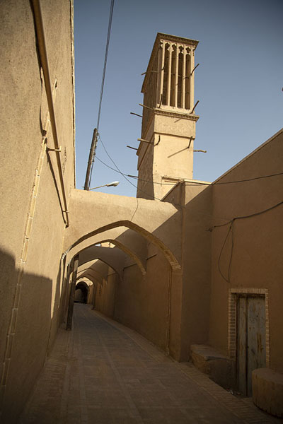 Wind tower looming over one of the many streets of the historic centre of Yazd | Yazd historic town | Iran