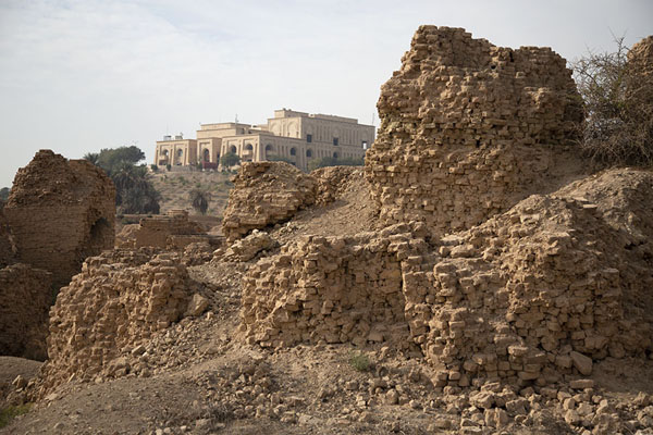 The ruins of ancient Babylon with the palace of Saddam Hussein in the background | Babylon | Irak